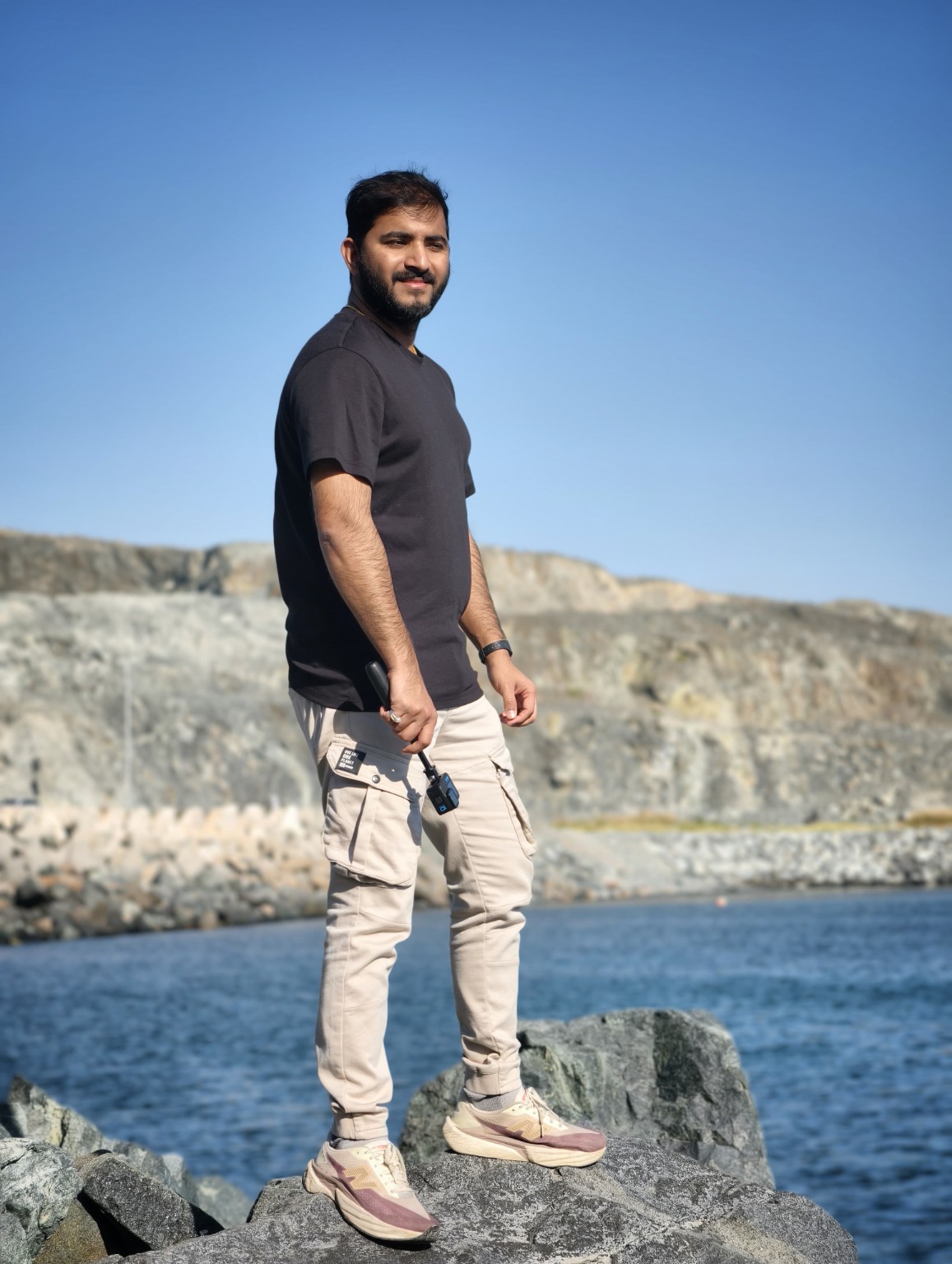 Arun Sudhakar standing by the water